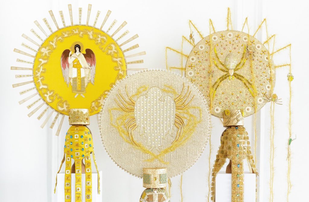 Golden sun embroidery display closeup of three items